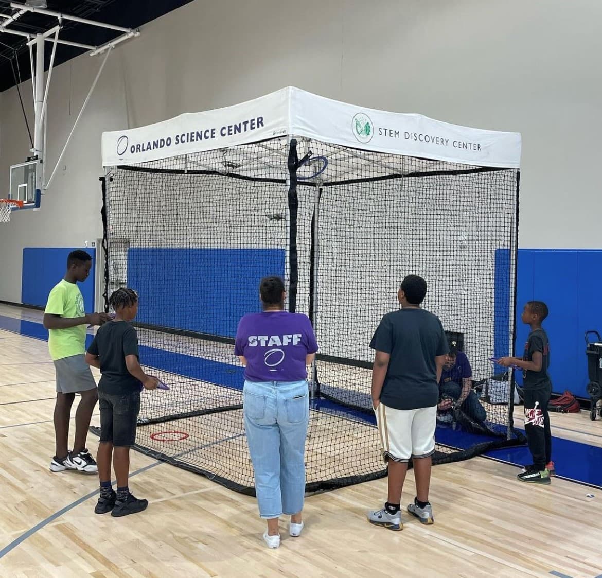 Grand Avenue - Science experiment in gym thumbnail image.